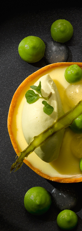 A most surprising and delightful dessert made with White Chocolate Tart with a Asparagus Ice Cream on top, finished with a Pea Puree &amp; Lemon Mint Gel, finished with Asparagus crisp 