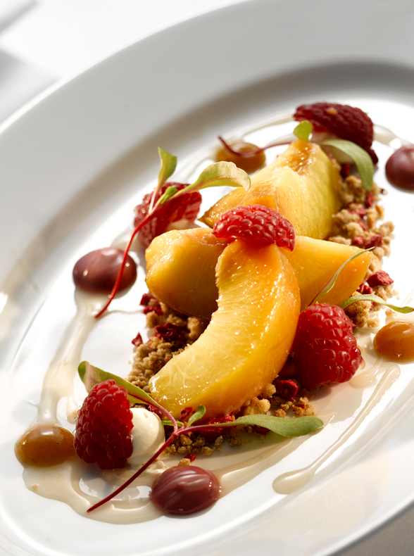 An energising dessert, colourful and refreshing with peaches and raspberries